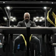 A man testing out the new ARMR plate-loaded machine from PLAE.